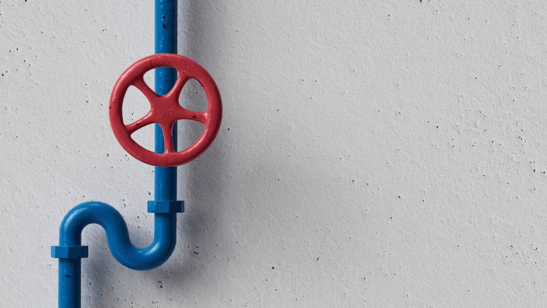 Blue pipe with a red valve wheel